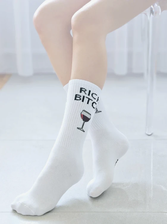 Białe skarpetki damskie Rich Bitch marki Crazy Socks.